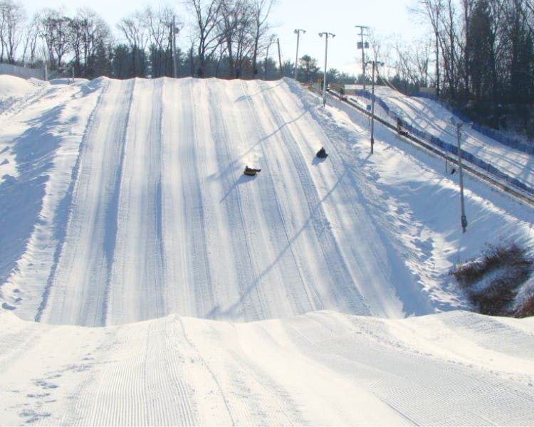 Enjoy thrilling outdoor adventure in the snow in the mountains at Pocono Mountain Villas at White Lightning Tubing.