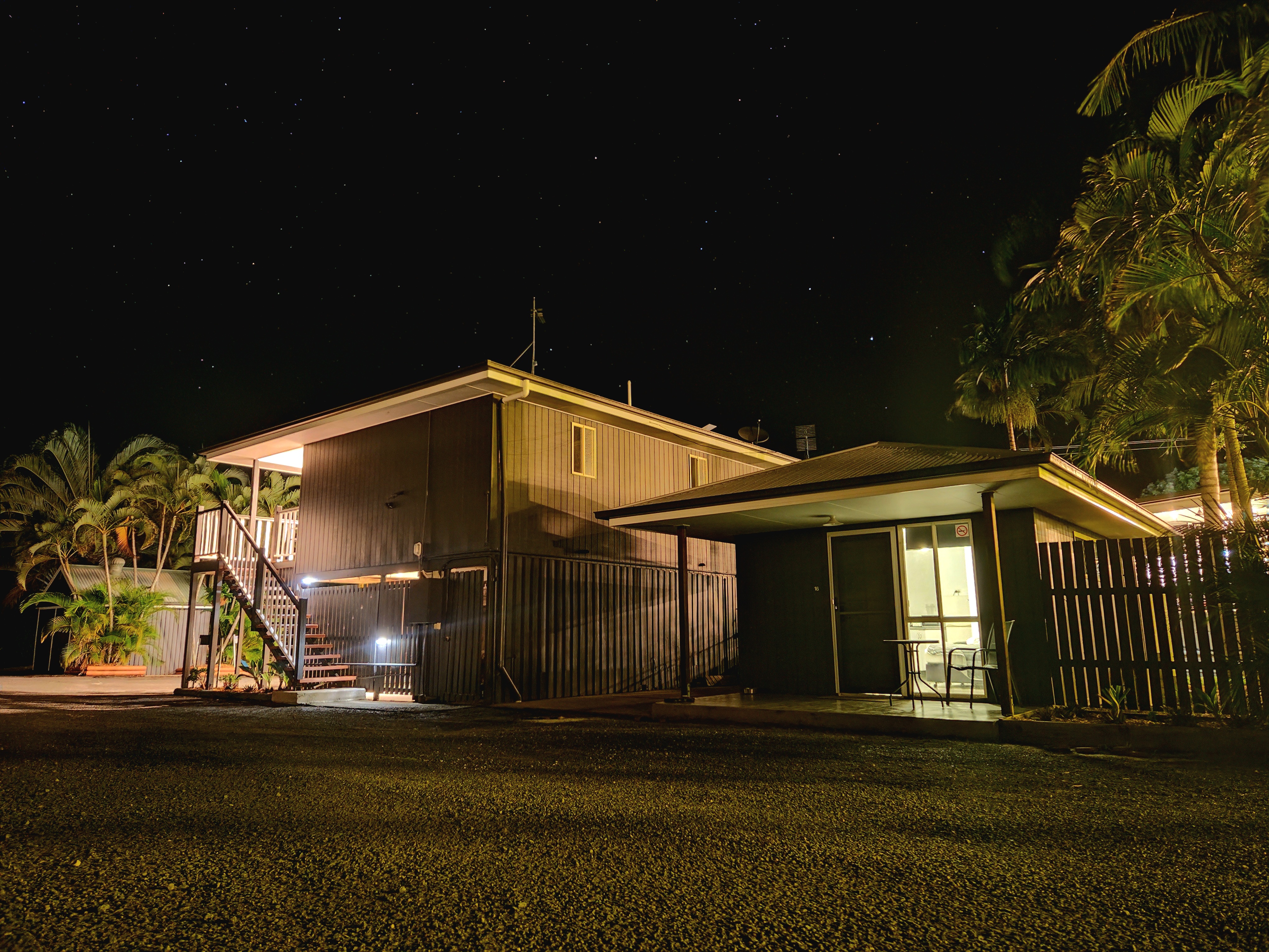 night view of cabin tucked away behind the motel