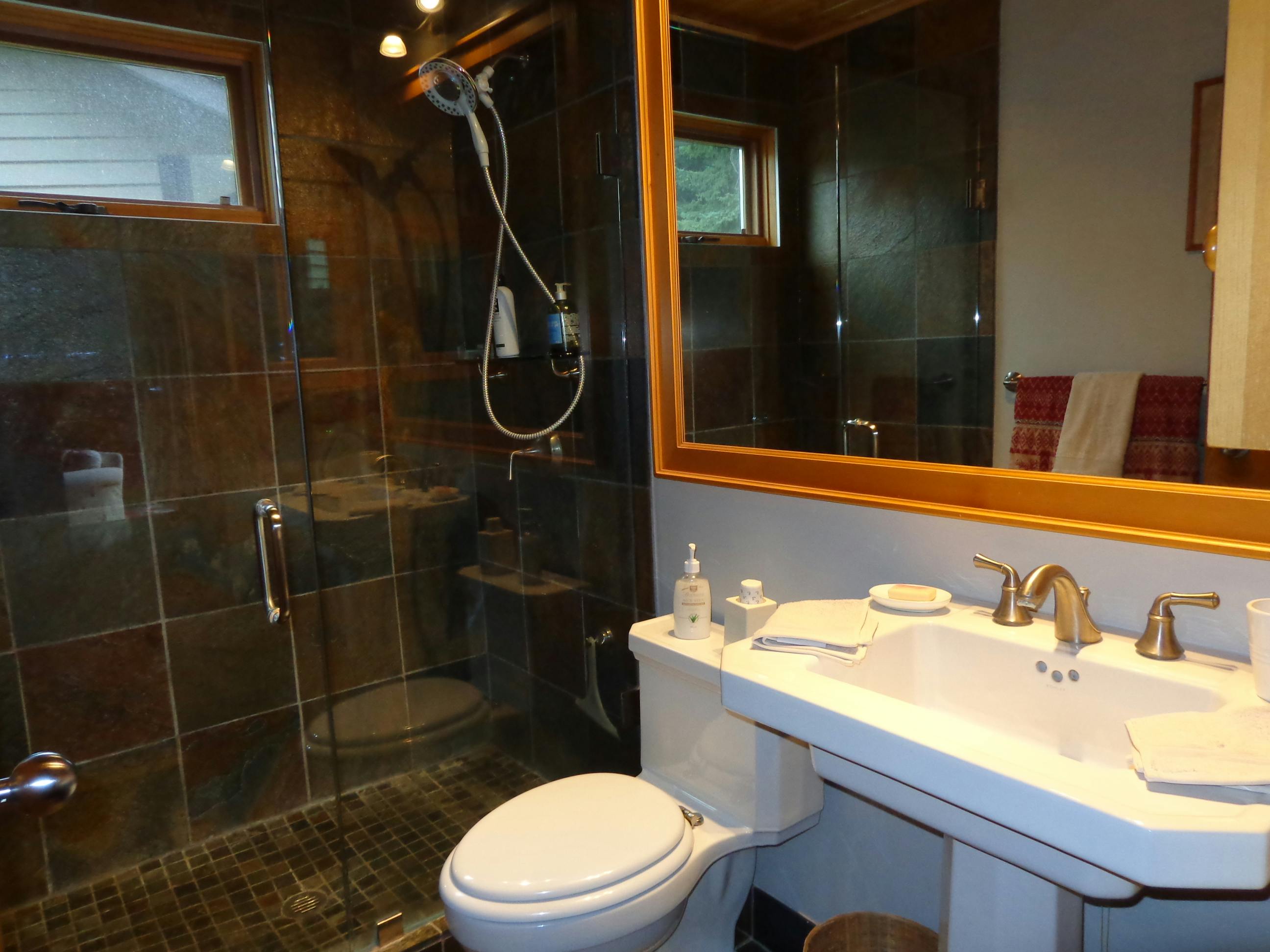 Garden View suite has stylish private bathroom with full shower