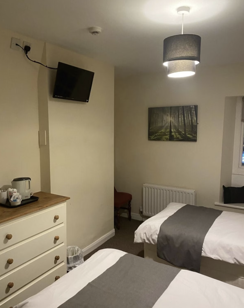 Twin room with separate private bathroom across the hall