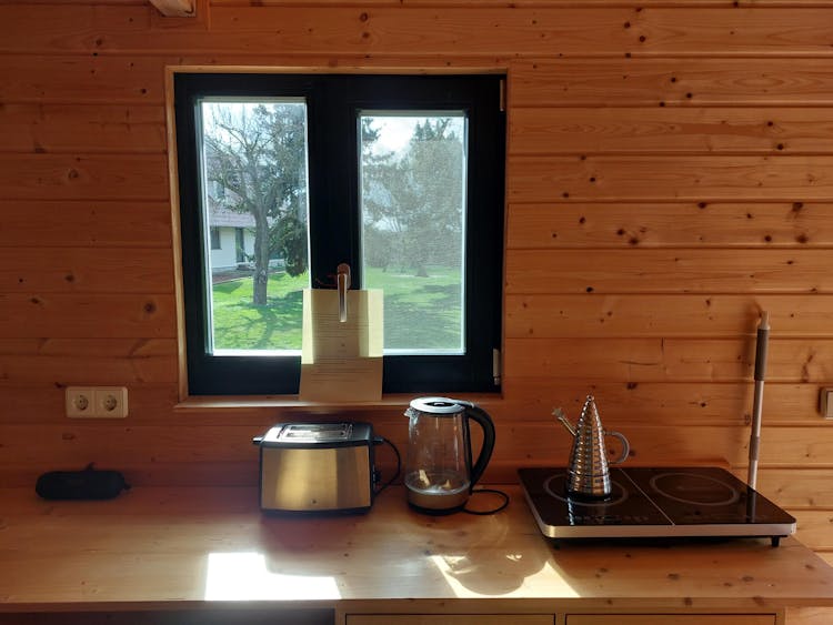The Red Wagon kitchenette is outfitted with toaster, electric kettle and electric stove top.
