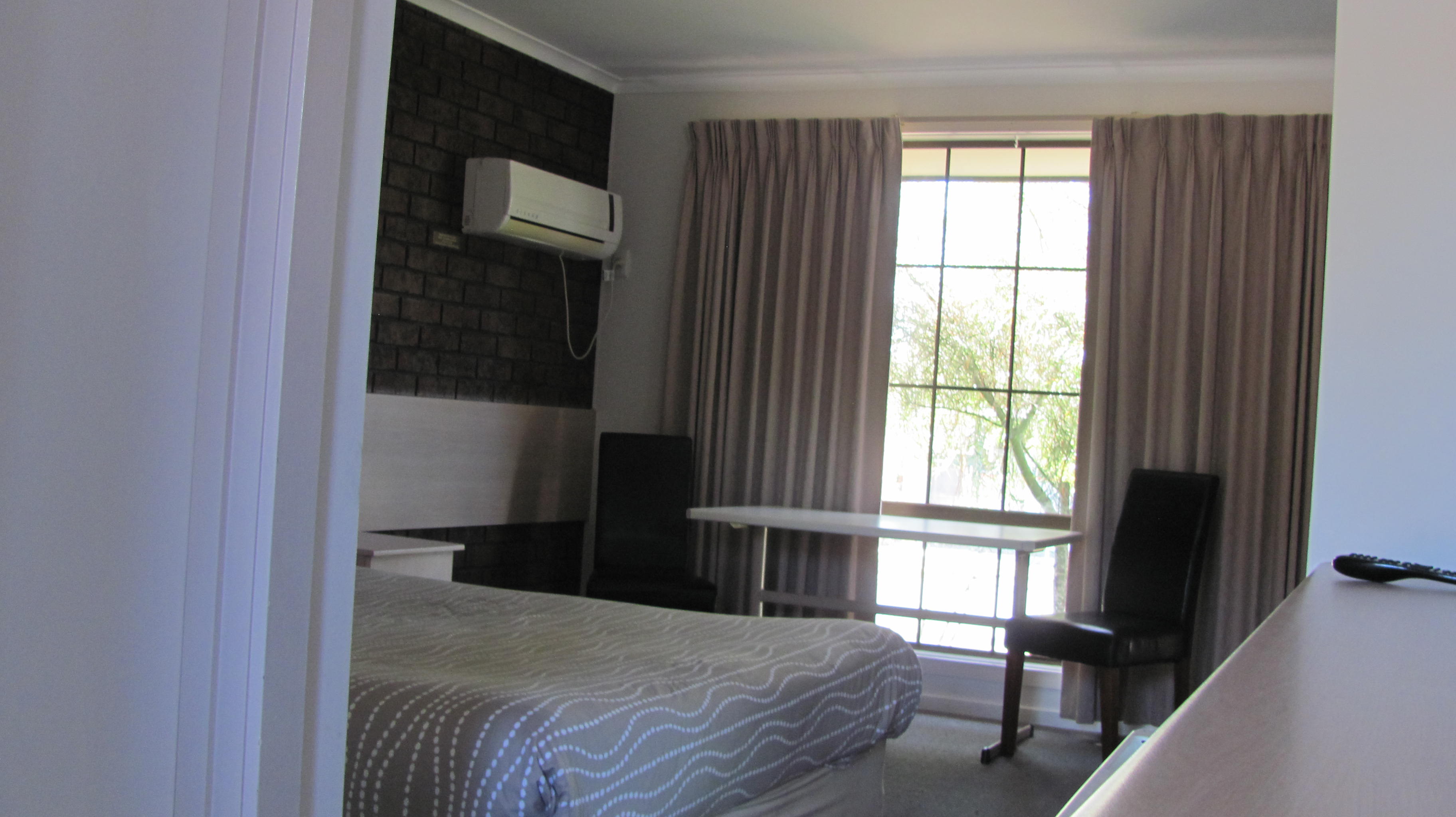 Family 2 room suite - main room with queen bed