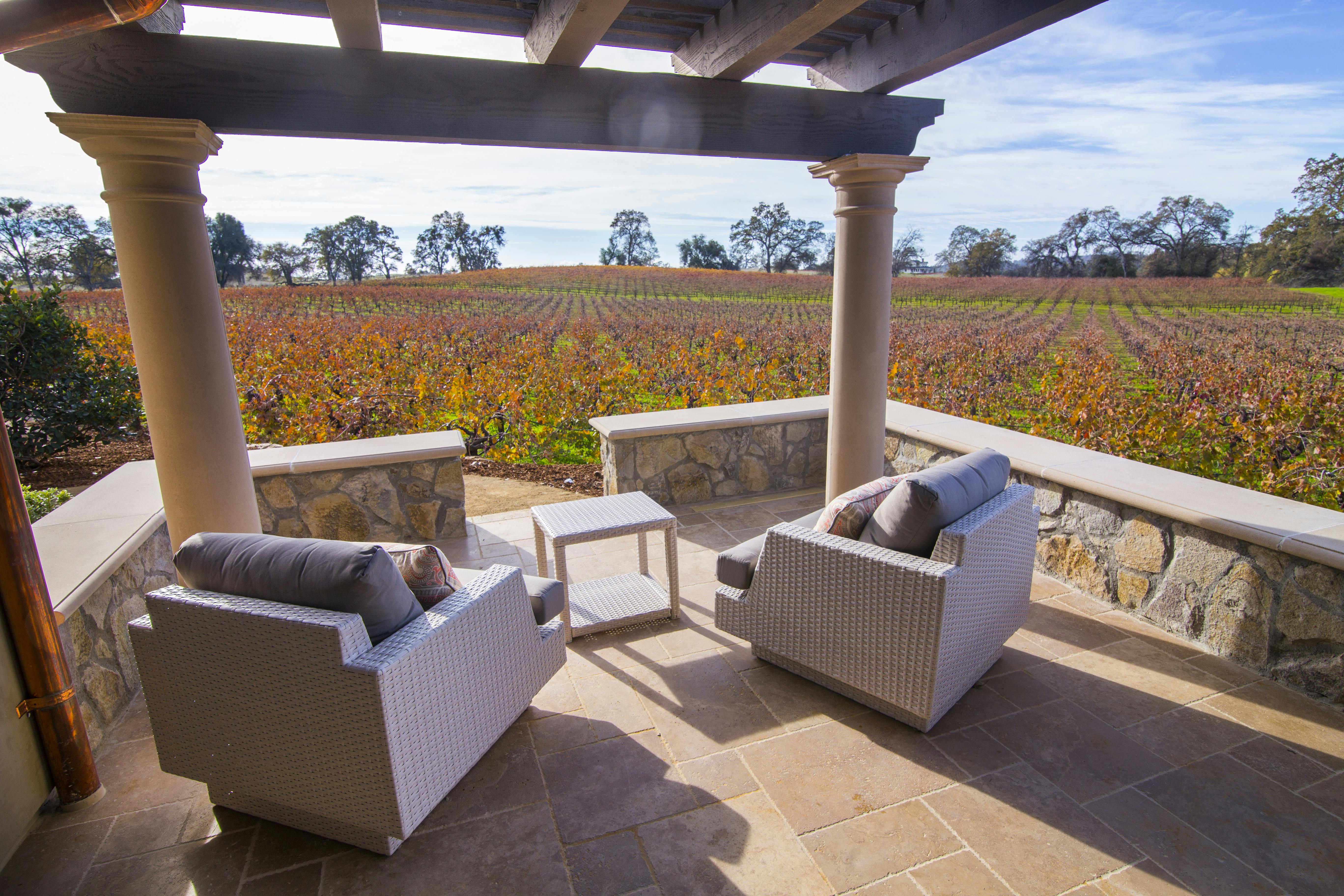 Imagine having your coffee in the morning and your wine in the evening on this private patio with stunning vineyard views
