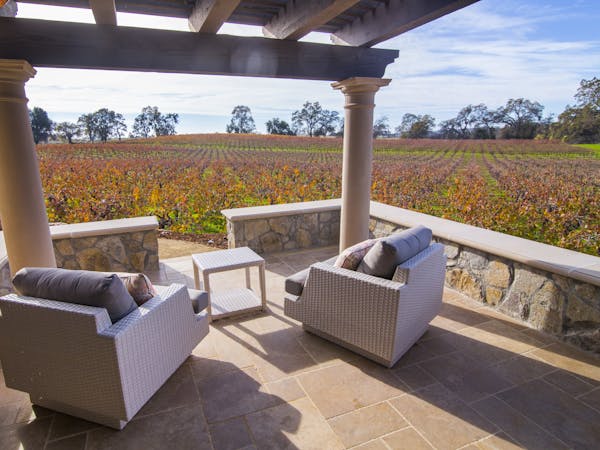 Imagine having your coffee in the morning and your wine in the evening on this private patio with stunning vineyard views