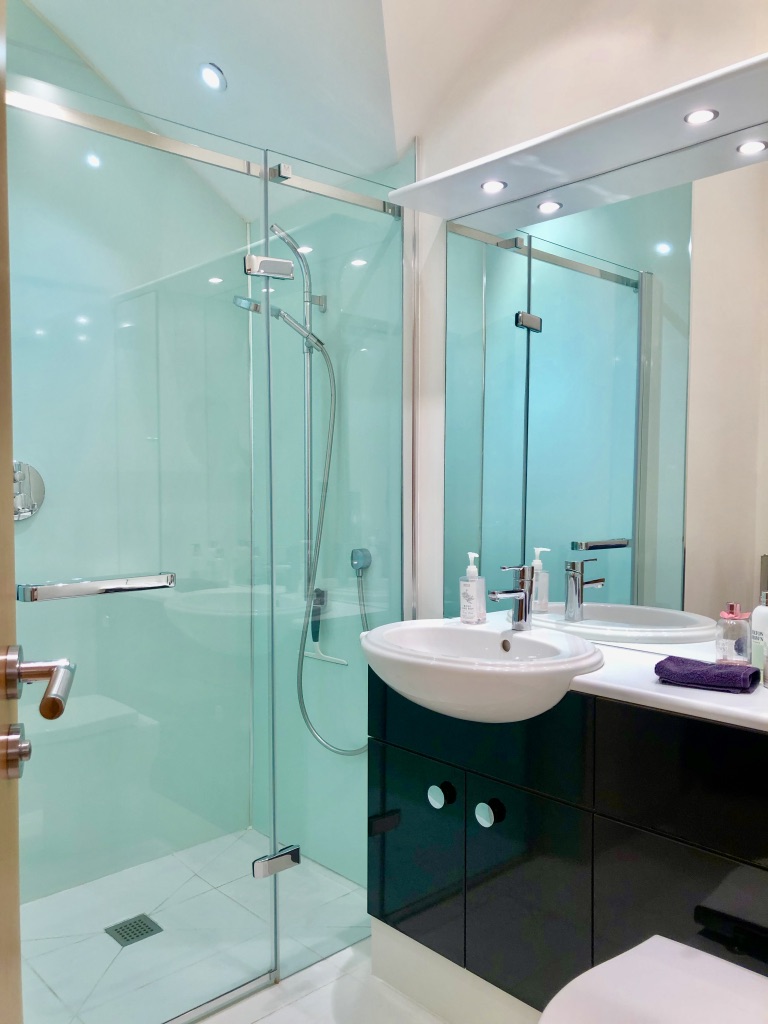 bedroom 2 En-suite wet room shower area with fitted cabinets