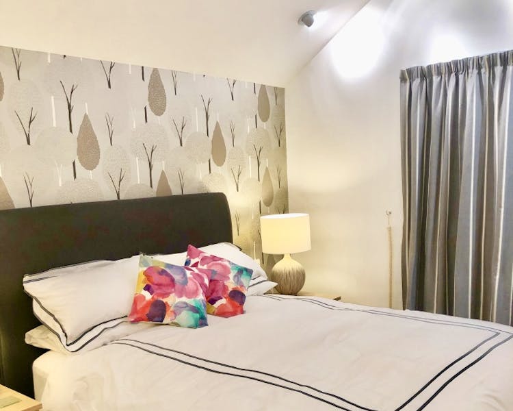 Bedroom 2 -Luxury king size bed with designer wallpaper