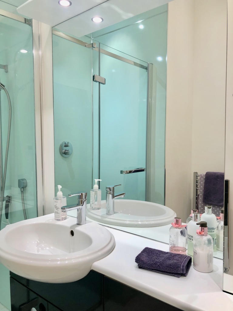 Bedroom 2 - En-suite integrated wash basin and oversized wall mirror