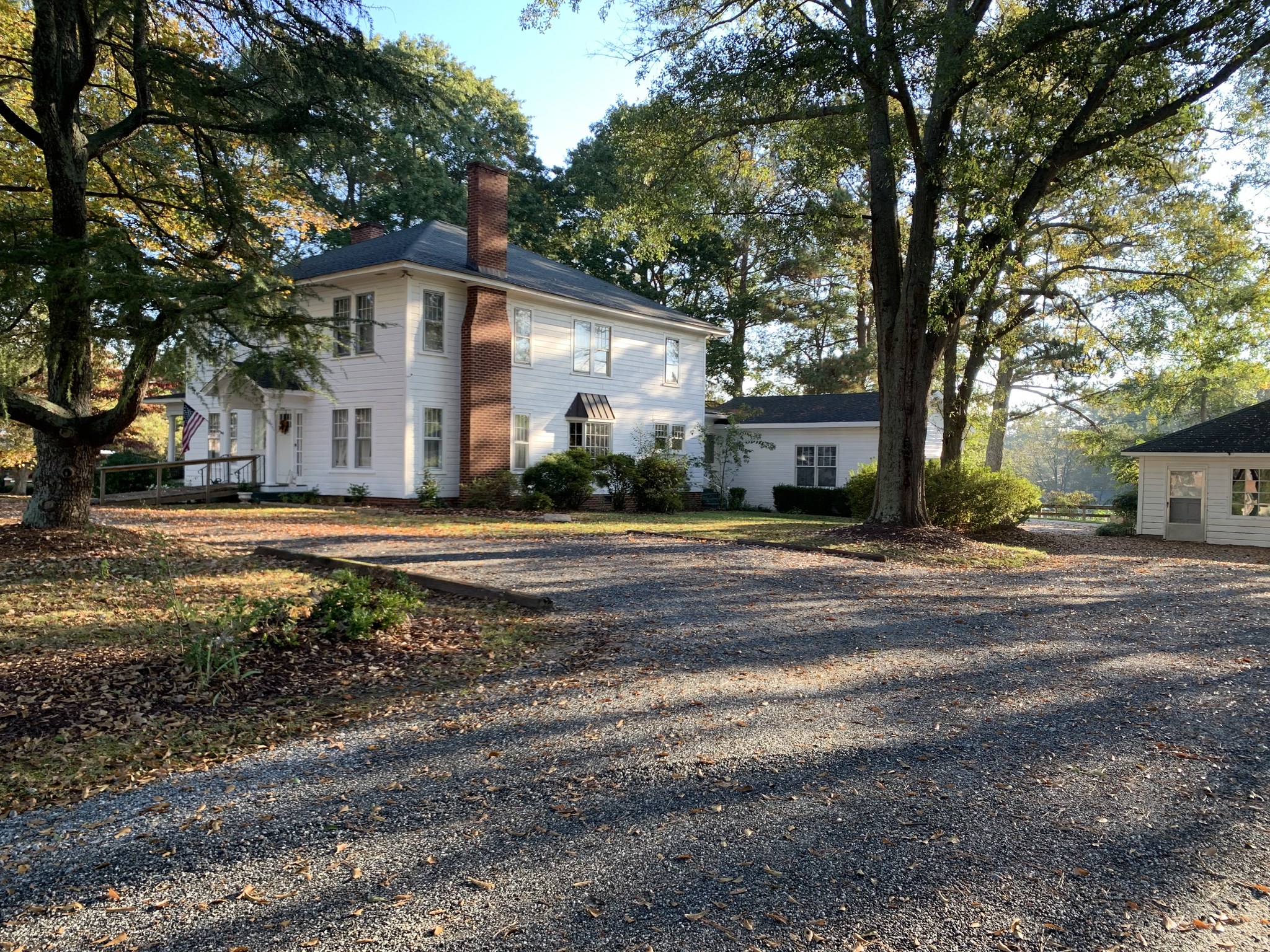 large gravel parking area at The Hunt House