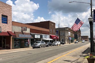 Brick building and storefronts lining Main Street in Fairfield, Il.