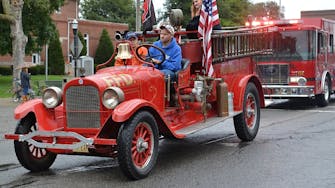 Vintage red firetruck in Fairfield, Il holiday parade