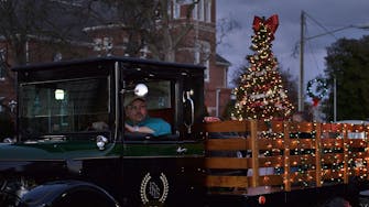 Vintage truck with Christmas tree in Fairfield, Il holiday parade