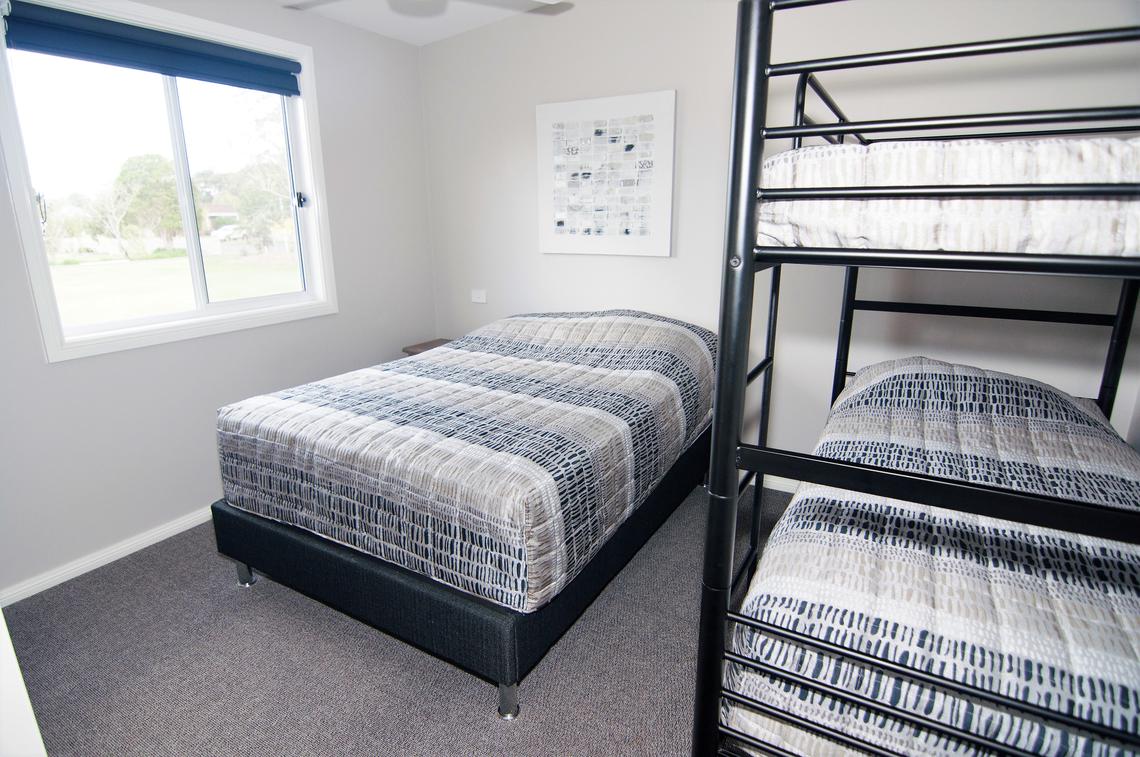 Unit 7 bedroom 2 with double bed and set of bunks