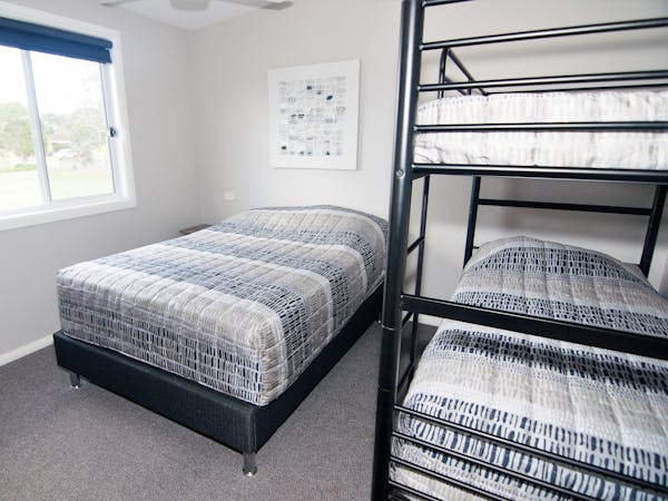 Unit 7 bedroom 2 with double bed and set of bunks