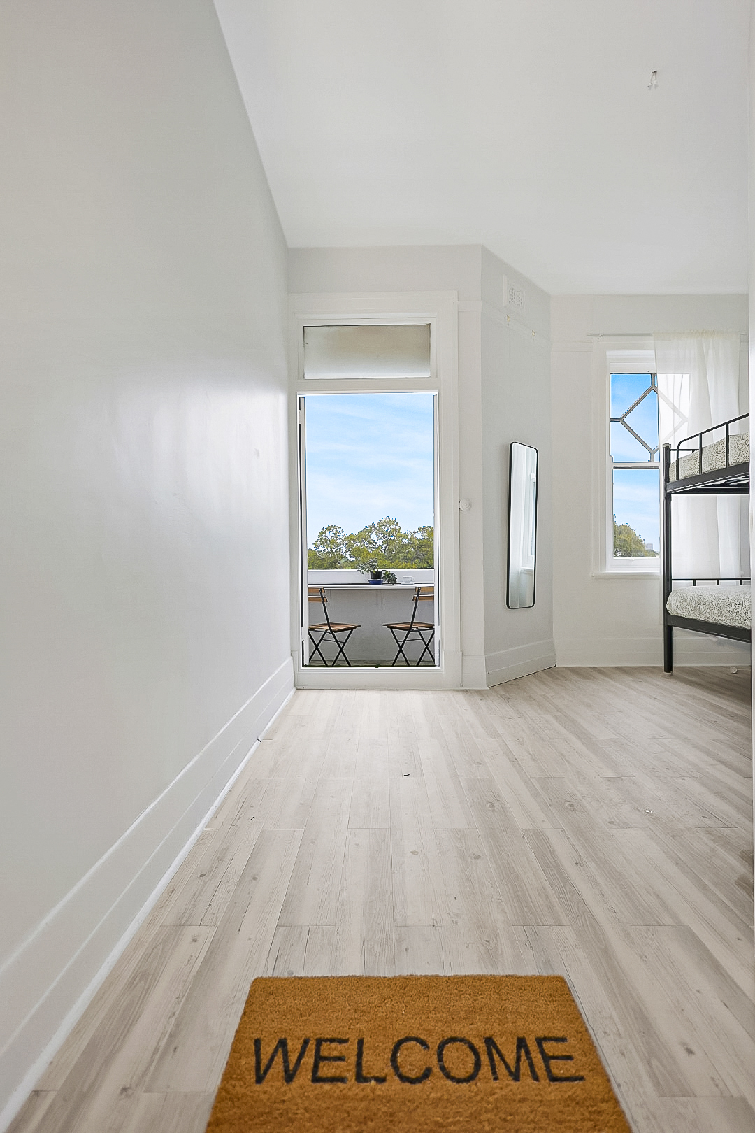 Spacious 4 Bed Deluxe Dorm with Balcony View and full length mirror