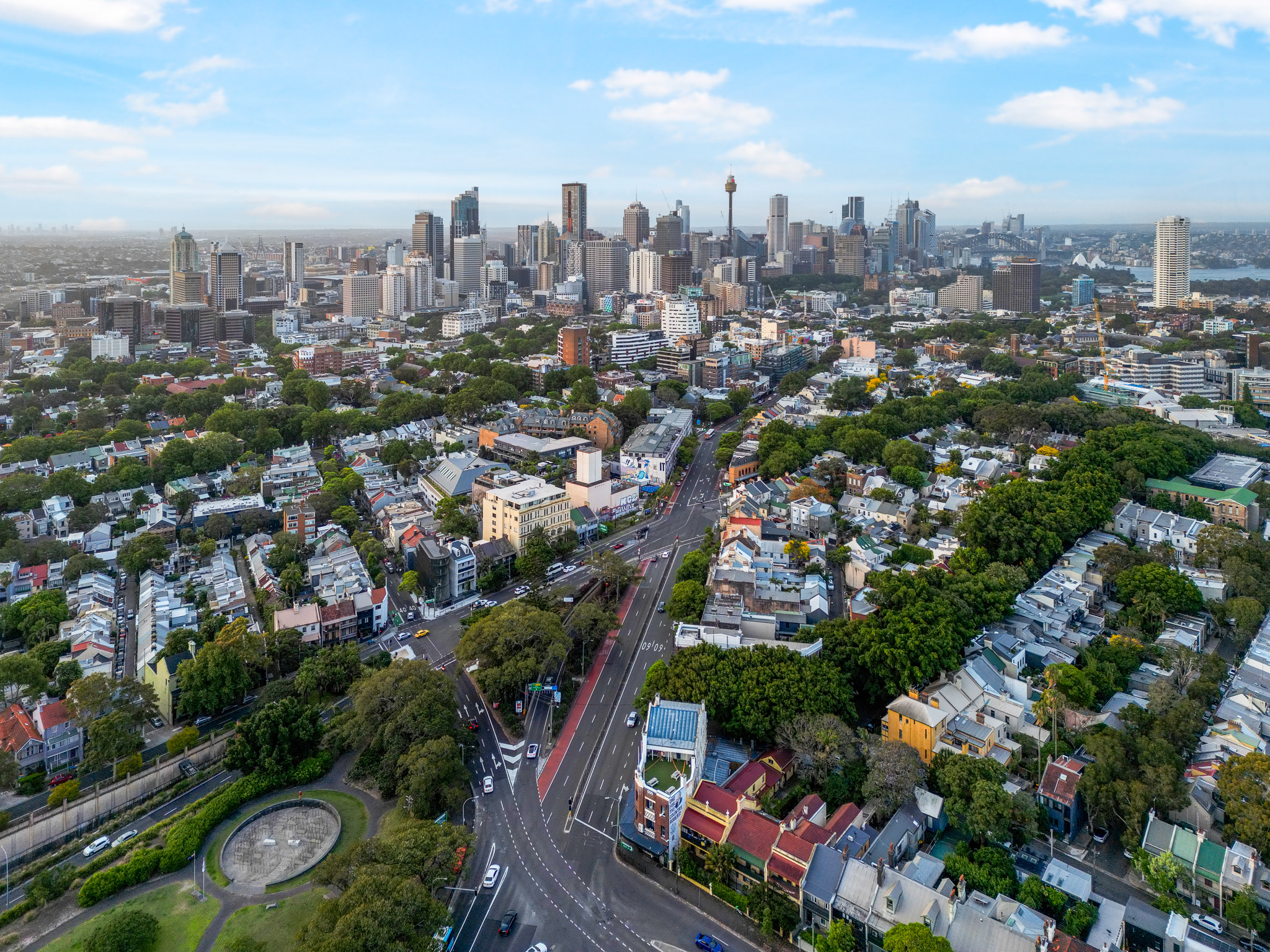 Exterior aerial birds eye view of Pad Hostel, Captain Cook Hotel, 162 Flinders St. City view of Sydney CBD and Harbour Bridge