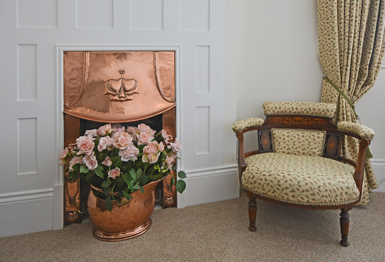 Haven Hall Hotel Bedroom 4 fireplace & antique chair