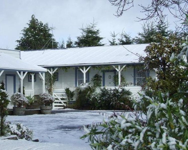 Snow outside Tongariro Crossing Lodge front entrance