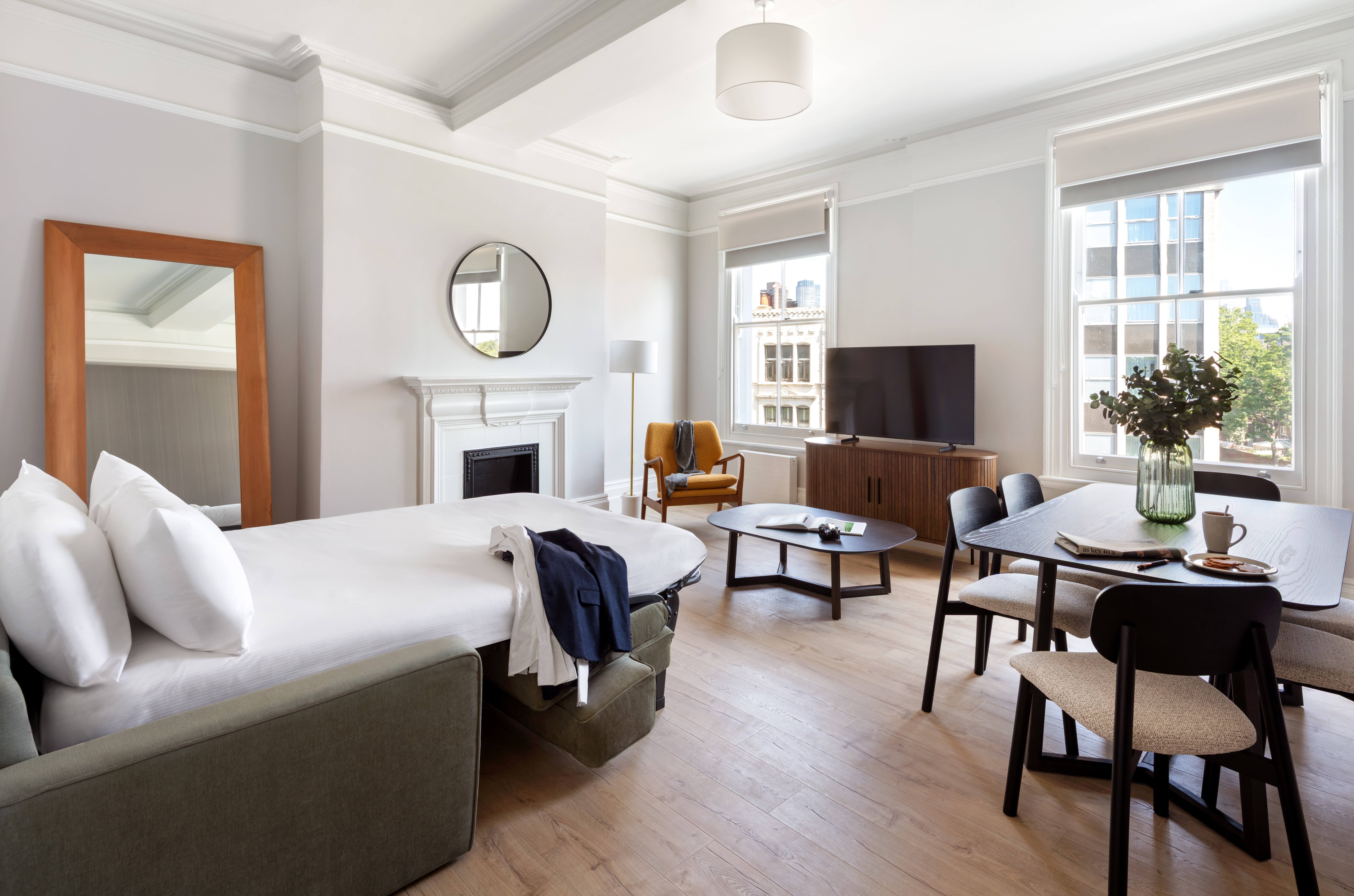 Spacious Modern Living space with seating area and sofabed