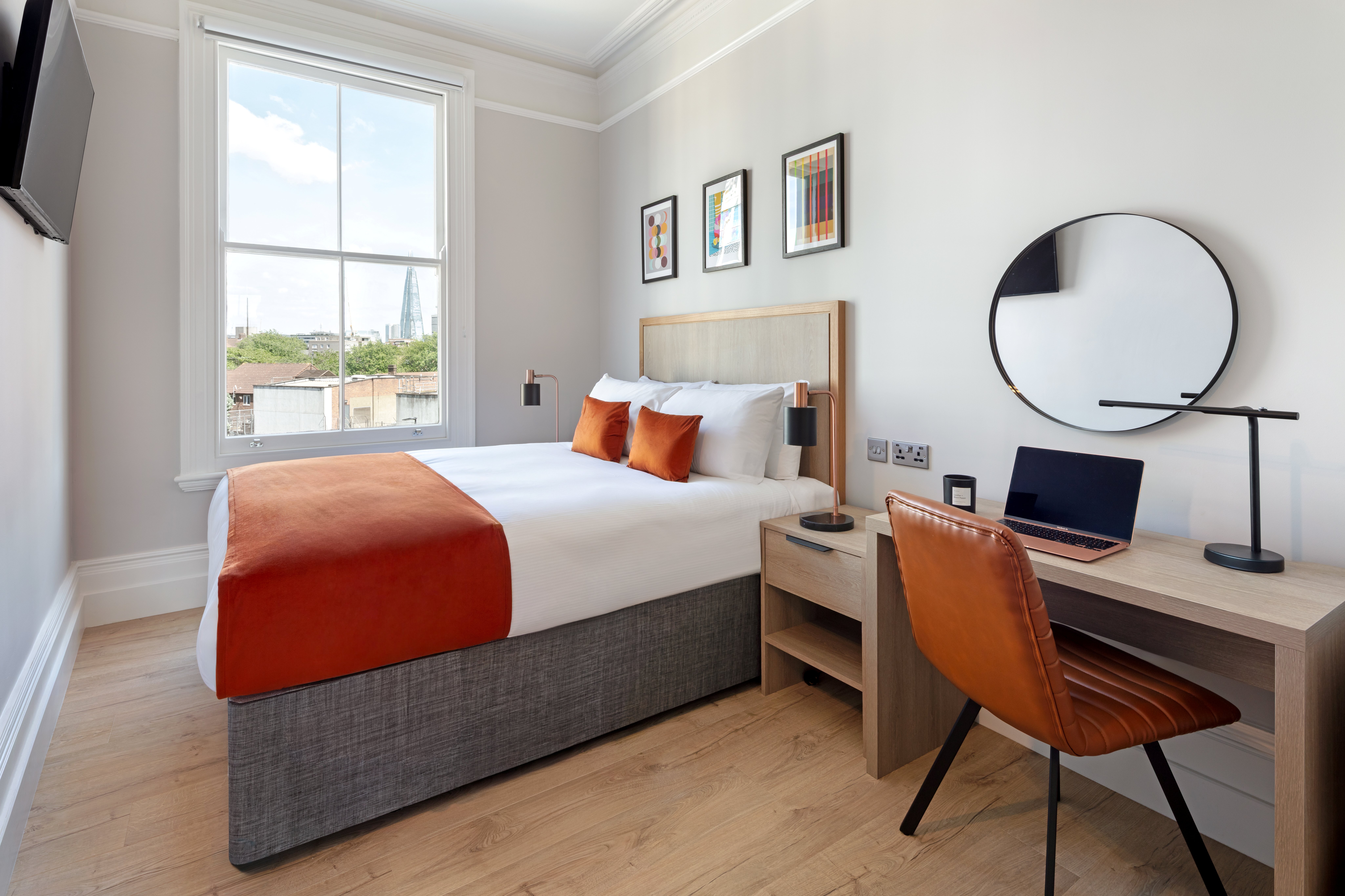 modern bedroom with large double bed and shard view