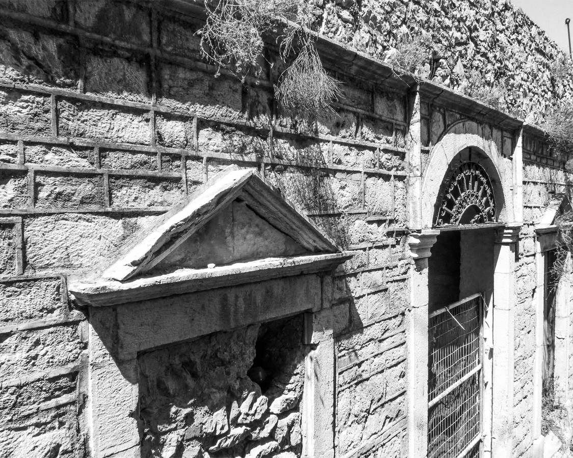 The Old Markets - Pre Restoration front with entrance and bars.