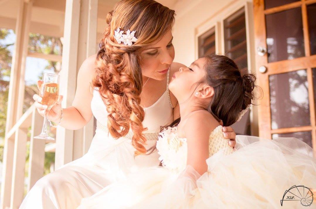 Bride & flower girl enjoying a special moment on the deck of their villa #erakorbeachweddings #weddingceremony