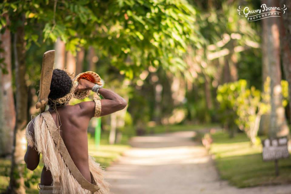 Conch shell blower warrior escort #erakorbeachweddings #weddingceremonyonthebeachsouthpacific #Vanuatutropicalbeachweddings
