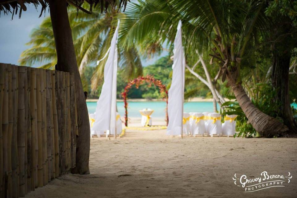 Coconut Beach Wedding Ceremony #erakorweddings #weddingceremonyonthebeach #Vanuatutropicalbeachweddings floral arch