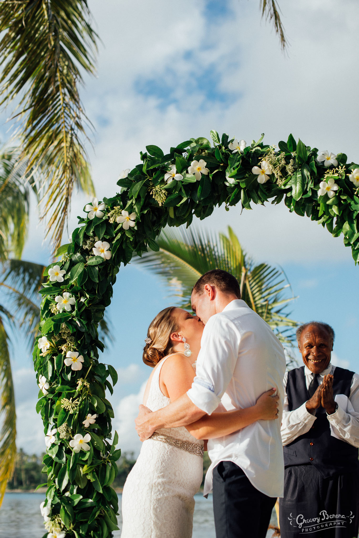 Coconut Beach with a beautiful Floral Arch #erakorweddings #weddingceremonyonthebeach #Vanuatutropicalbeachweddings