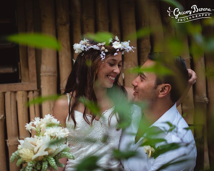 Sharing a romantic moment on Calypso Beach #erakorbeachweddings #weddingceremonyonthebeach #bridalbouquet