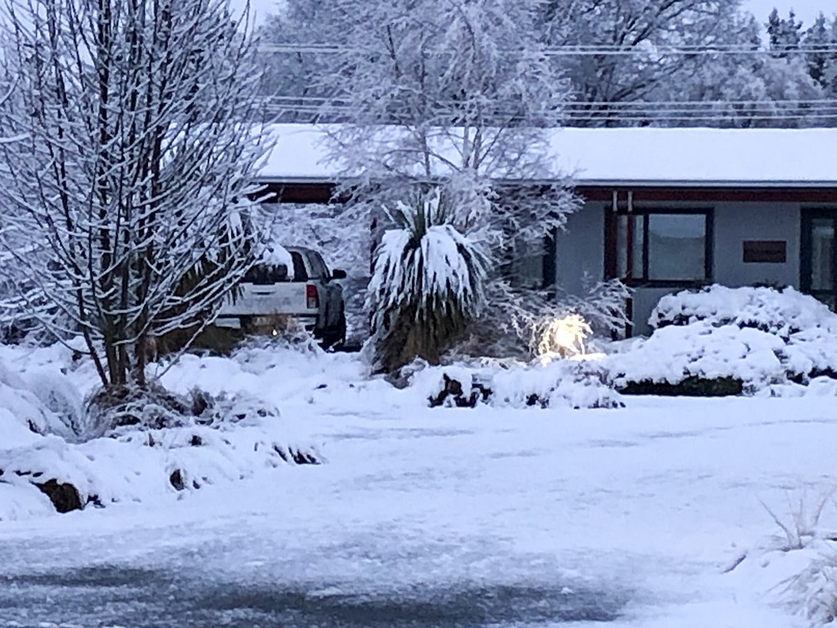 A rustic-modern cabin in the snow at Musterer's Accommodation, Fairlie.