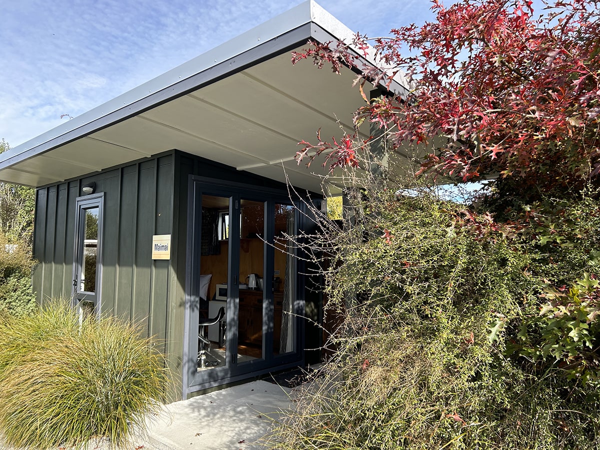 Entrance to a rustic studio cabin at Musterer's Accommodation, Fairlie.