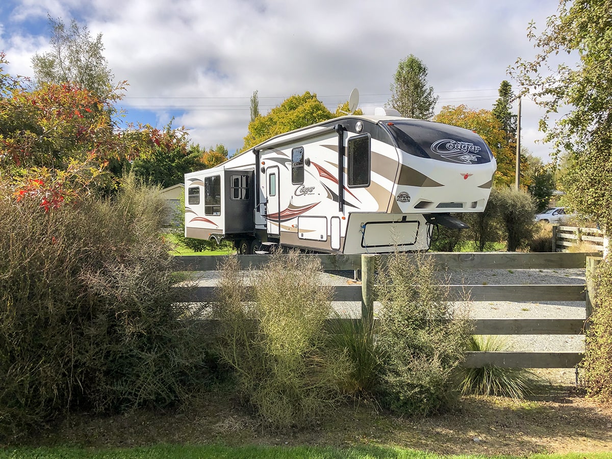 Campervan parking with native shrubs at Musterer's Accommodation, Fairlie.