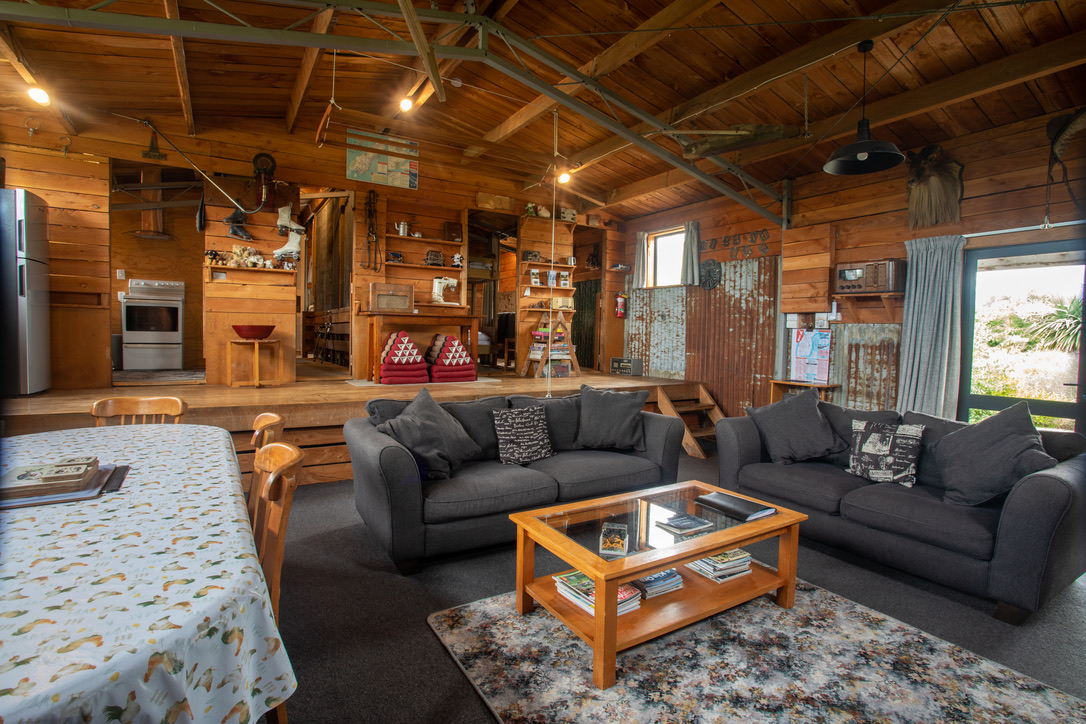 A large rustic living area in an old woolshed at Musterer's Accommodation, Fairlie.