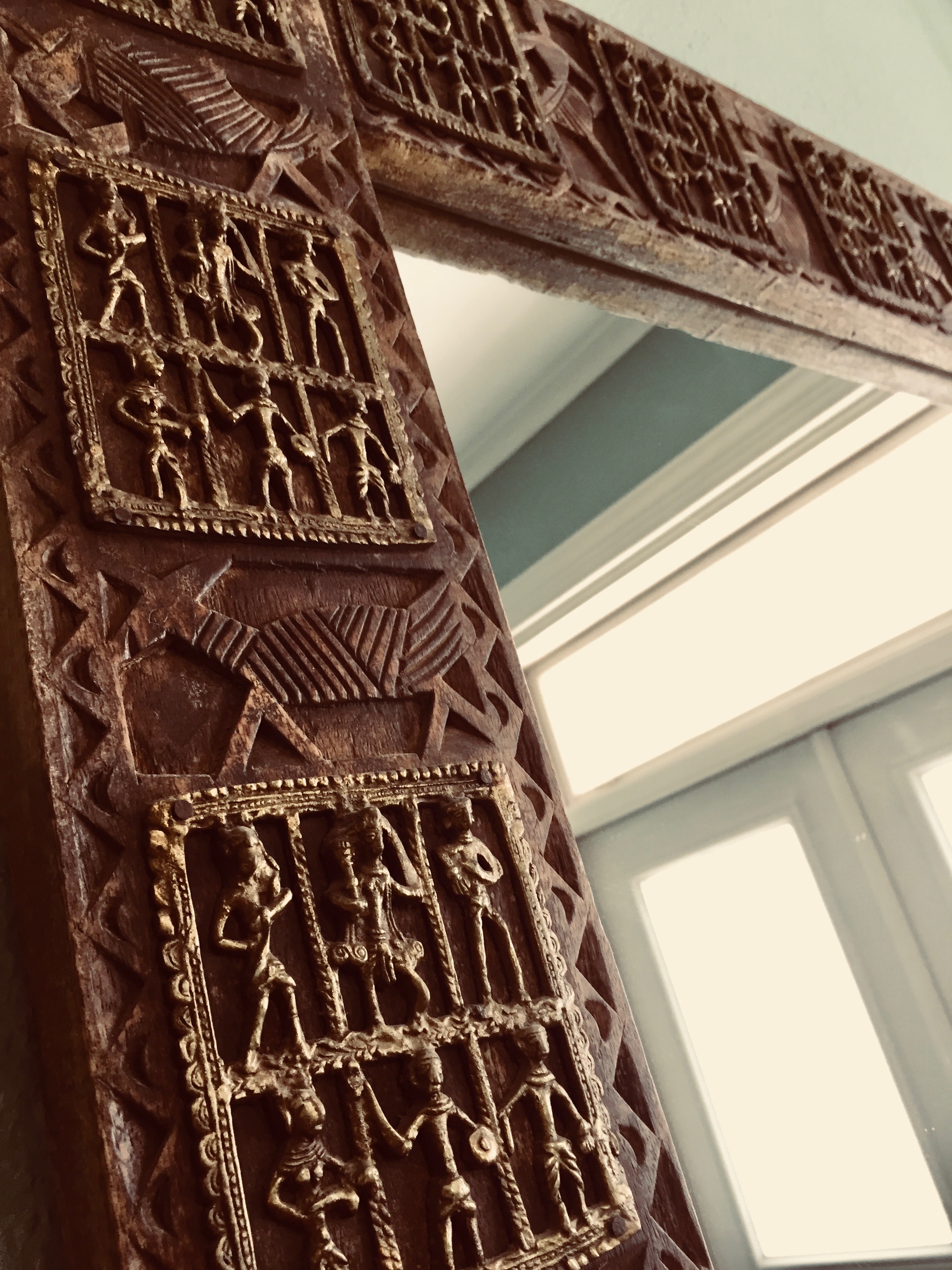 Indian mirror on up cycled wood in Three Pheasants entrance area