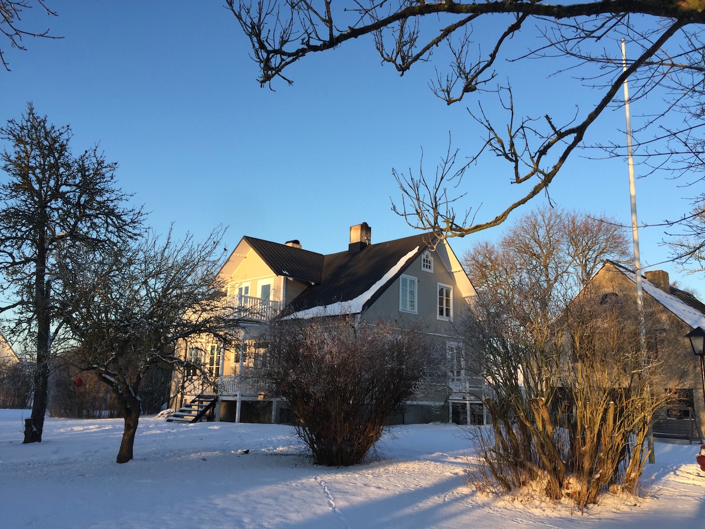 Side view of boutique bed and breakfast in snowy winter