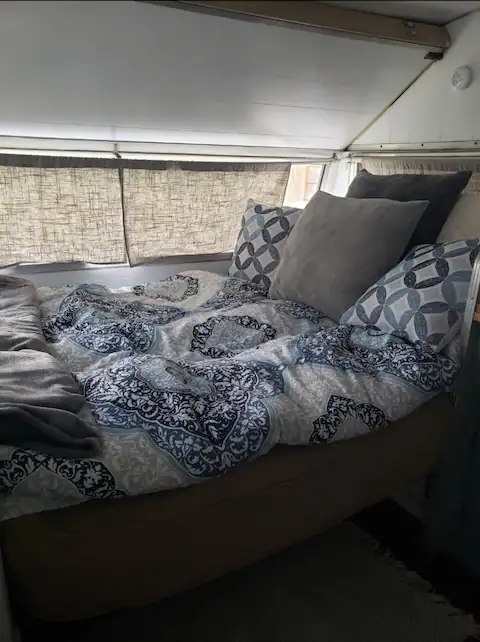 The vintage camper know as Palmer. A full futon for sleeping with a sitting area.