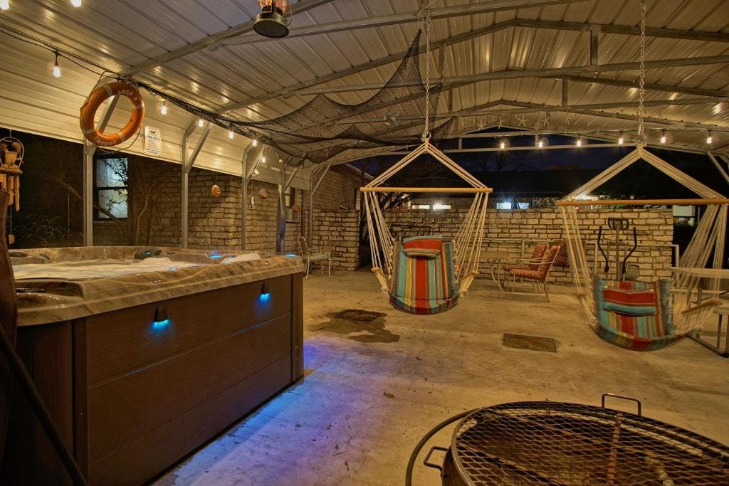Pavillion area with hot tub and gas grill