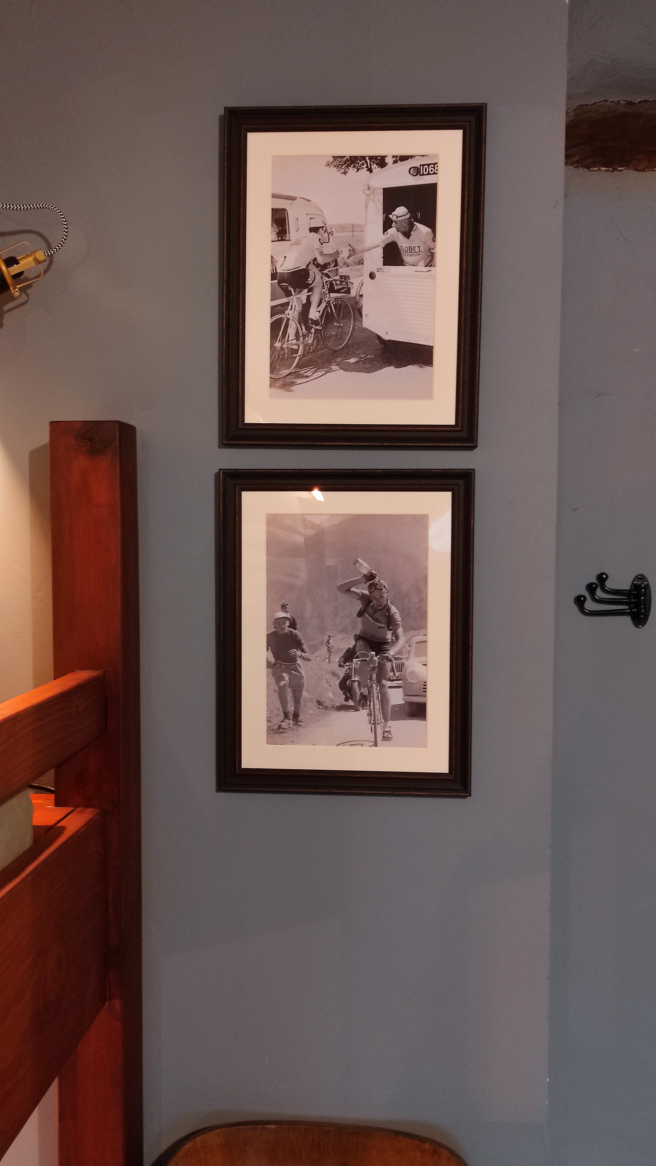 Close-up of retro pictures of race cyclists as decoration in a hostel-style room for cyclists at La Maison Vienvenue.