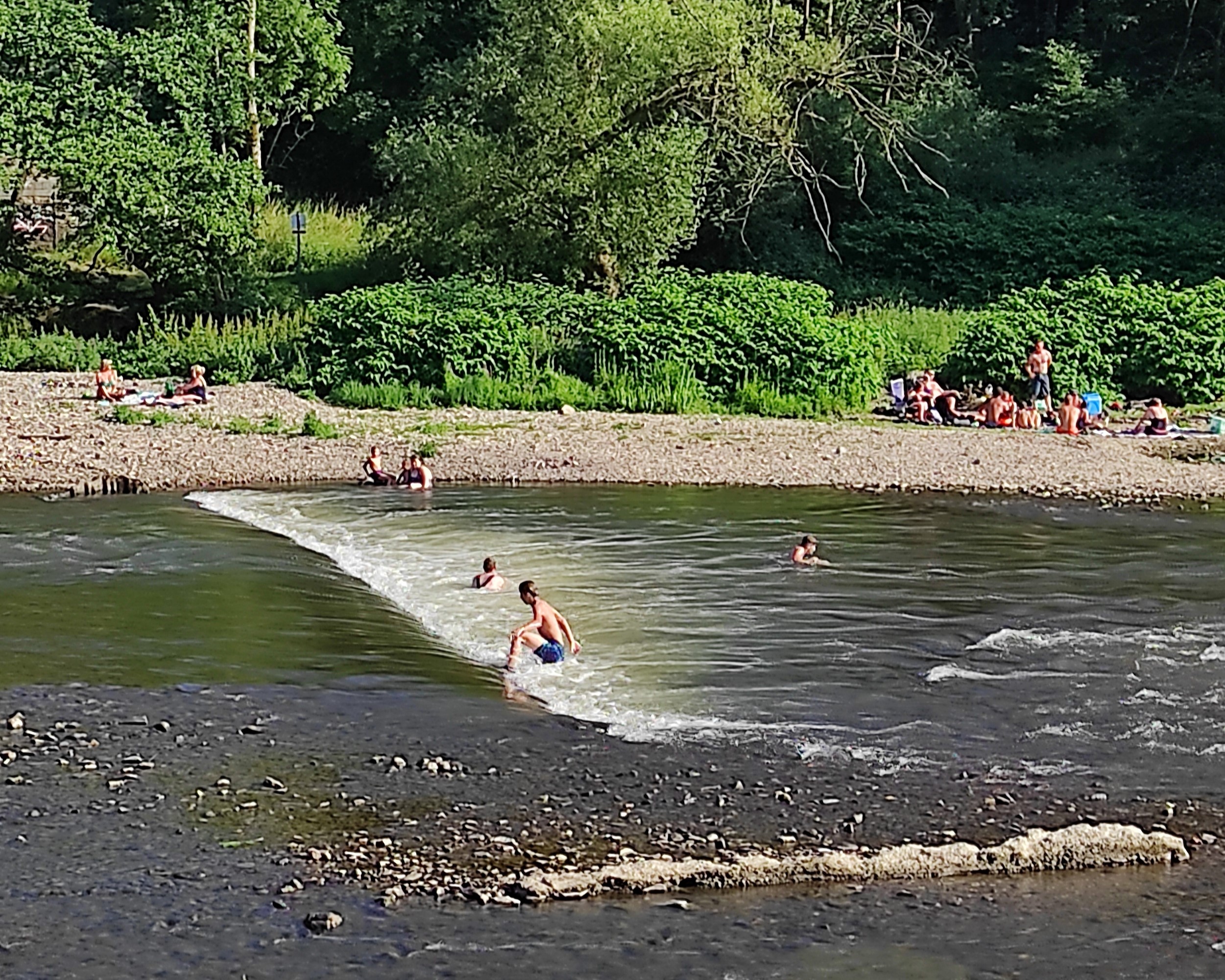 Children enjoying swimming in the River Ourthe, next to the recommended cycling path near La Maison Vienvenue.