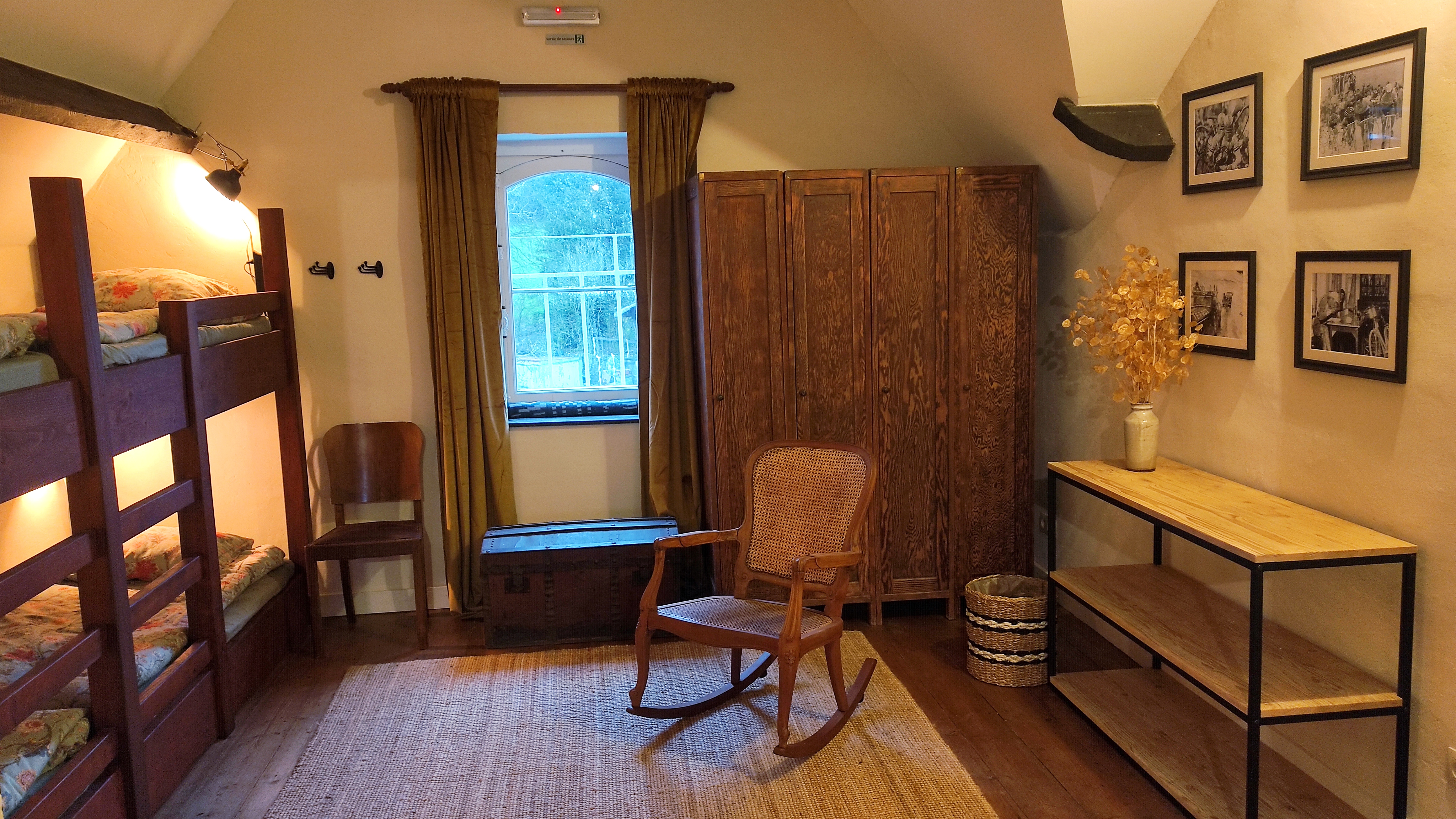 Relaxing rocking chair in a large hostel-style room at La Maison Vienvenue.