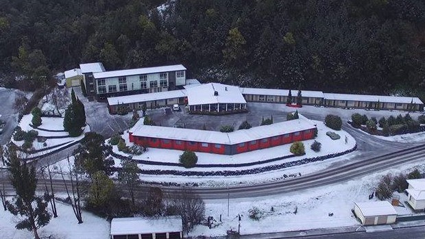 Arial shot of Silver Hills Motel in snow