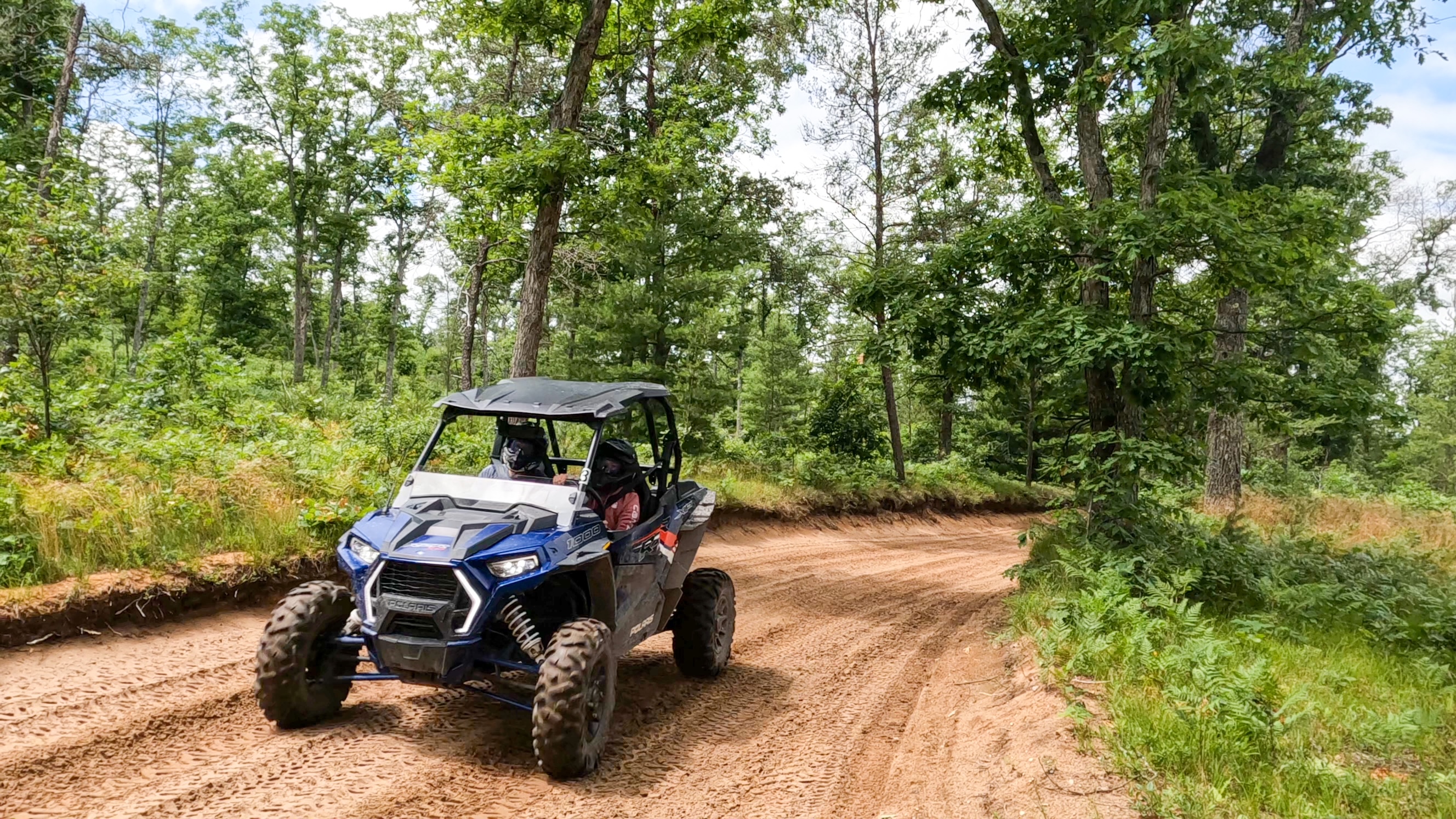 alt="Customers enjoying Polaris UTV rentals — tearing up Michigan’s sand trails, adventure starts at Best Bear Irons MI"