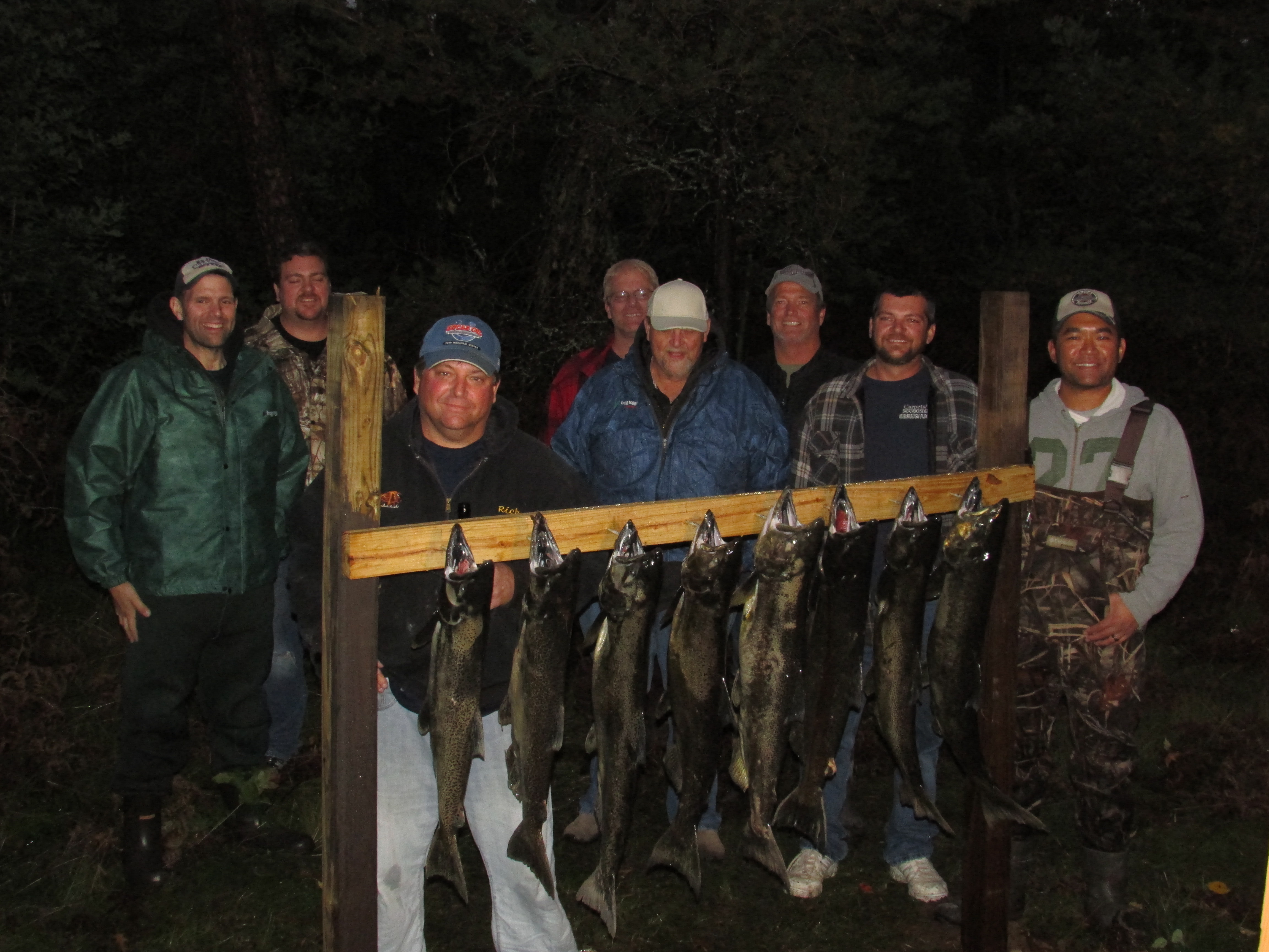 alt="Guest showing off a large fish caught at Best Bear Lodge & Campground in Irons Michigan"
