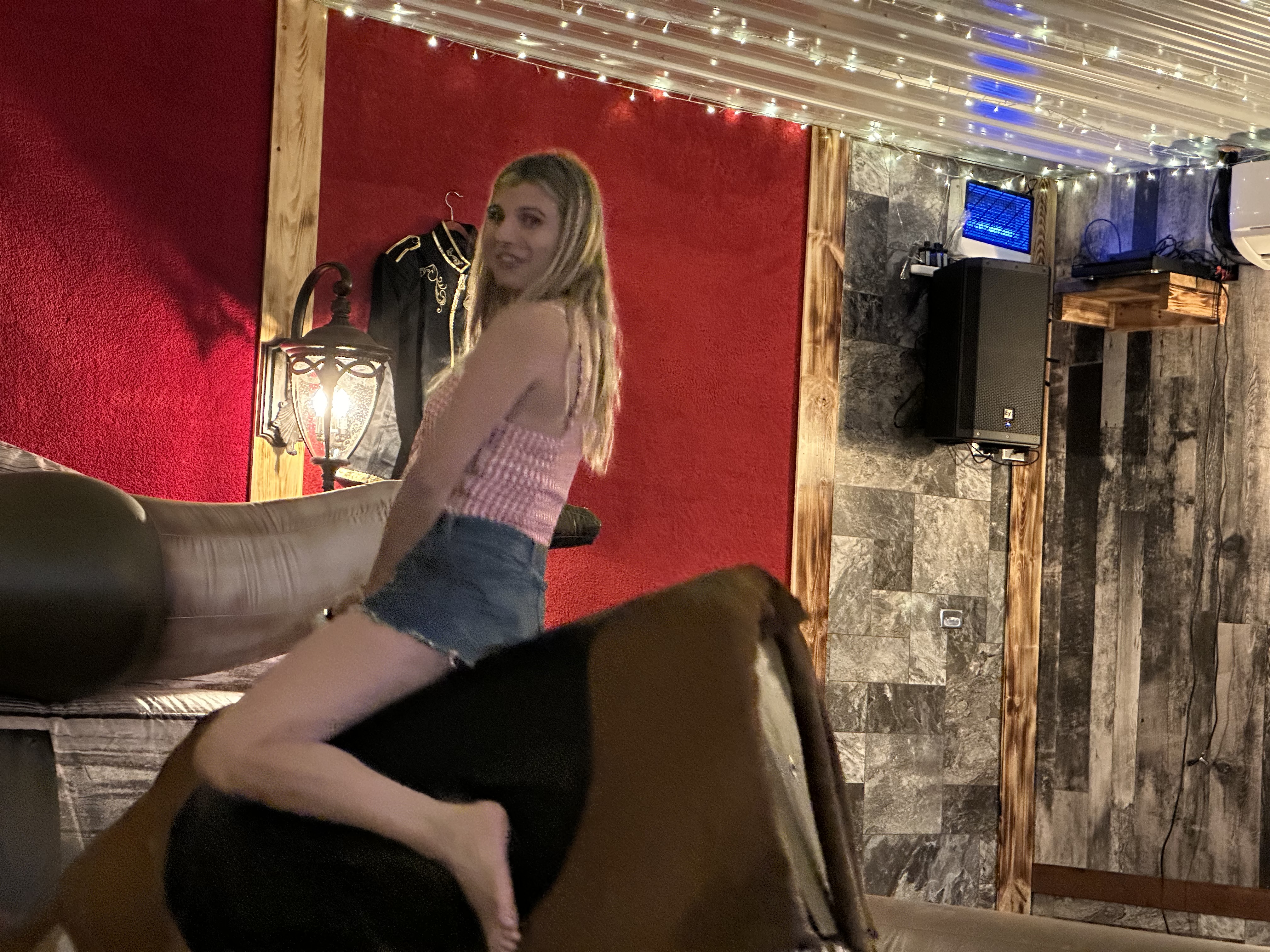 alt="Mechanical bull riding at Rhinestone Event Center, Best Bear Lodge & Campground in Irons Michigan"