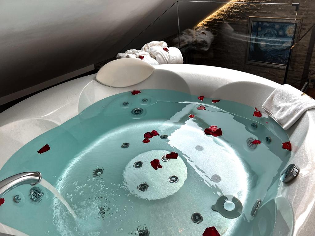 Jacuzzi with rose petals – Romantic relaxation in-room spa