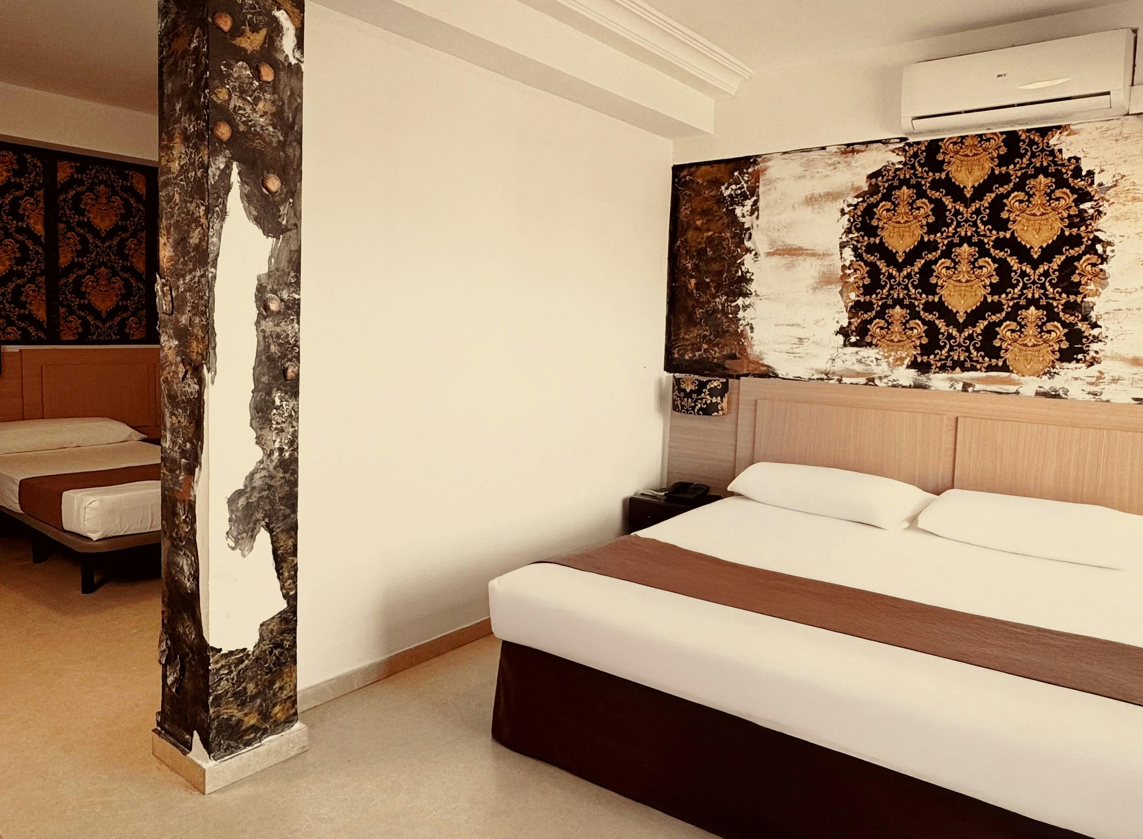 Deluxe Room with one double bed and two single beds