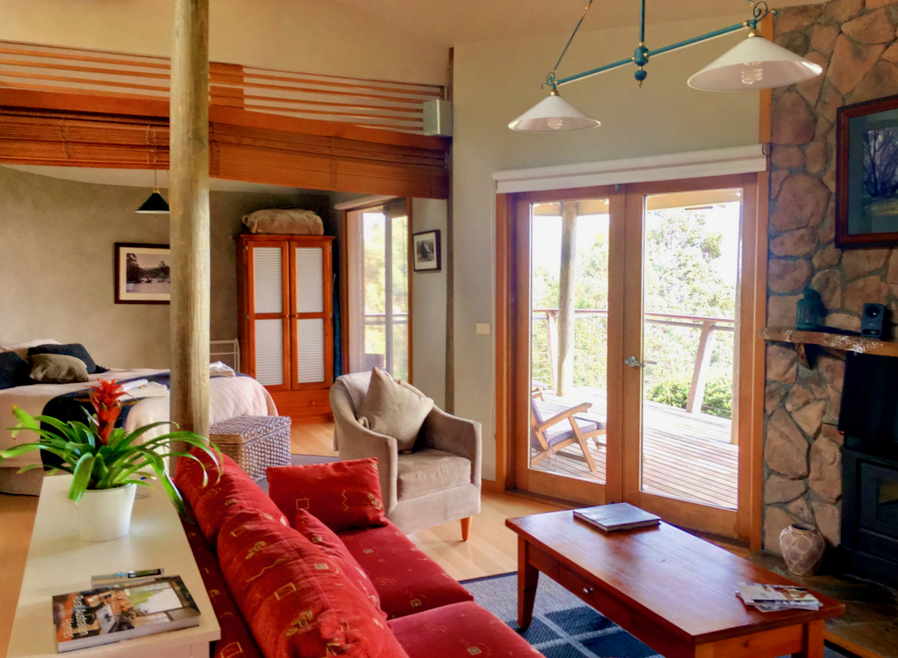Open plan living with french doors leading to the deck at Taronga
