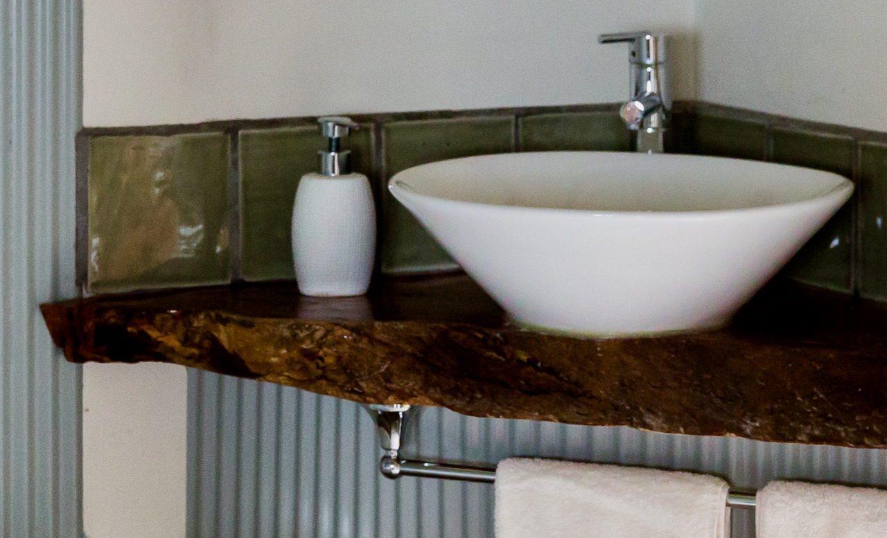 Modern bathroom with a bush hut influence