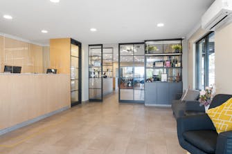 Hotel reception desk and internal entrance to Kal Brew Co