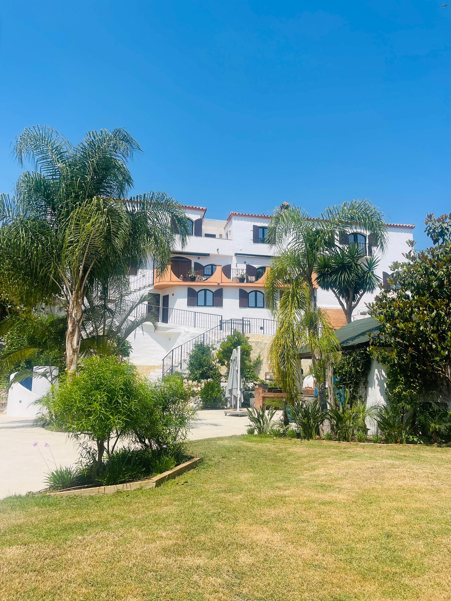 Lawn view of the house during the day 1